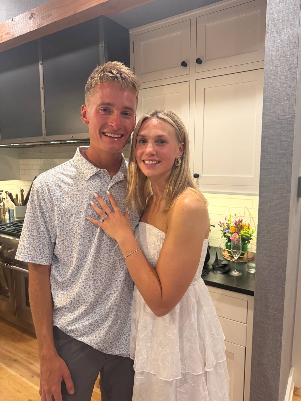 Tucker and Syd showing their engagement ring